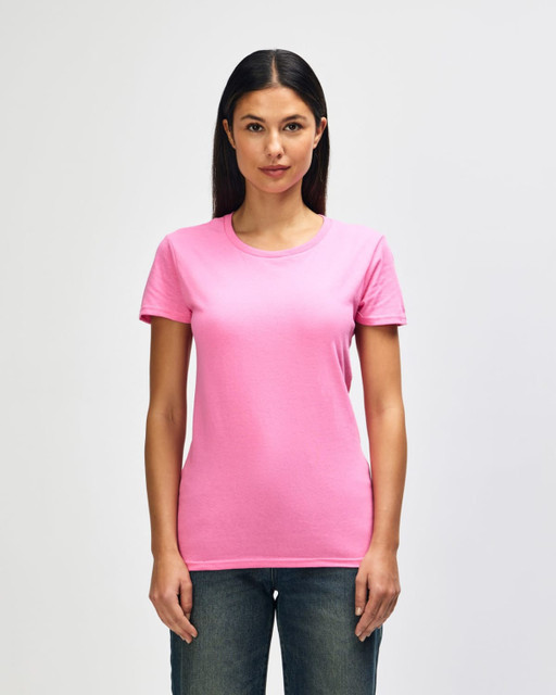 A pink Gildan Heavy Cotton Ladies' T-Shirt displayed on a model, featuring a round neck and short sleeves.