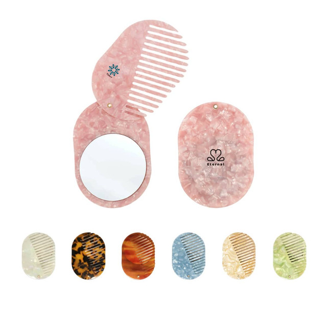 A portable pink acetate hair comb with a mirror, featuring various additional colours and a logo design.