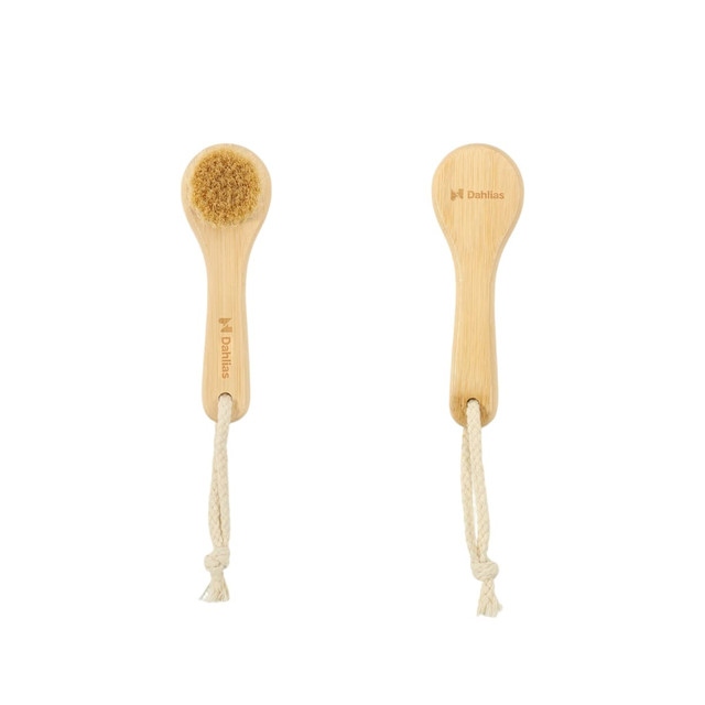 A natural wooden face brush with a soft bristle head and a rope handle, featuring branding on the handle.