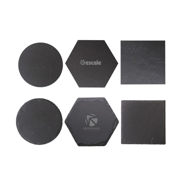 A set of slate coasters in various shapes: round, square, and hexagonal, featuring an embossed logo on some.