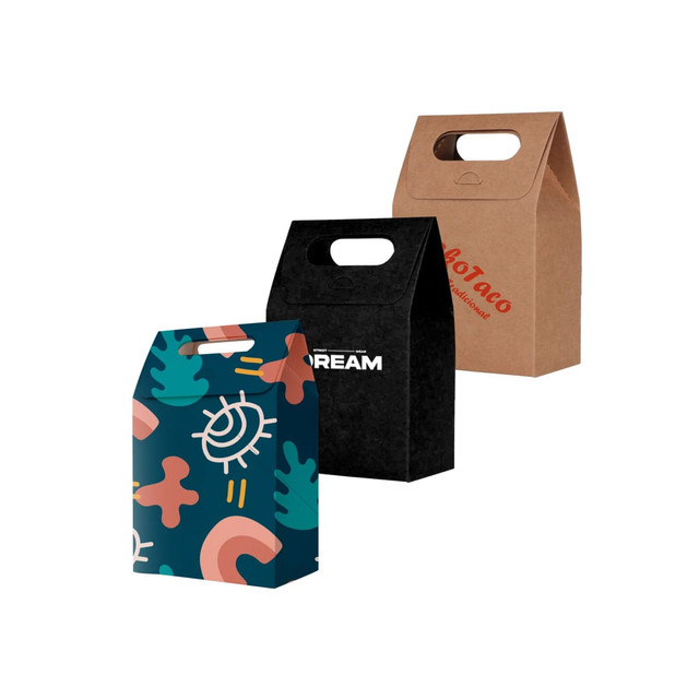 Three die cut handle bags in various designs: one floral, one black with white text, and one brown kraft.