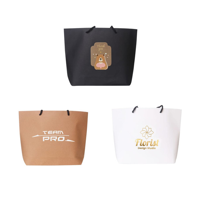 Three paper bags in black, brown, and white, each featuring different designs and a logo.