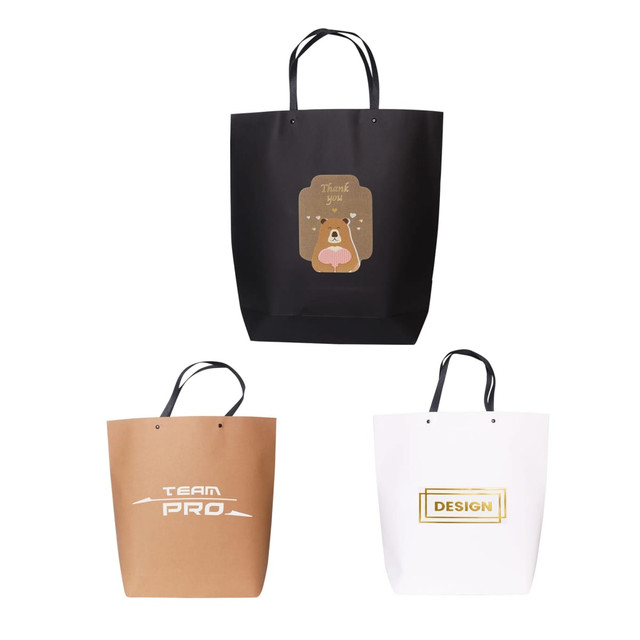 Three large boutique paper bags in black, brown, and white, each with unique designs and handles.