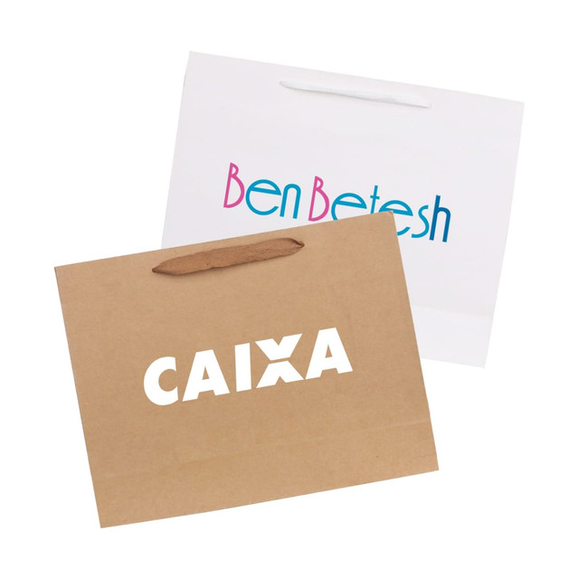 A large crosswise paper bag in white and brown with fabric flat handles, featuring logos on both sides.