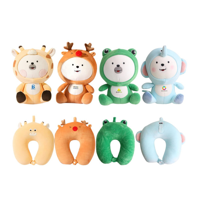 A collection of sitting animal-shaped plush travel pillows in various colours, including orange, green, blue, and beige.