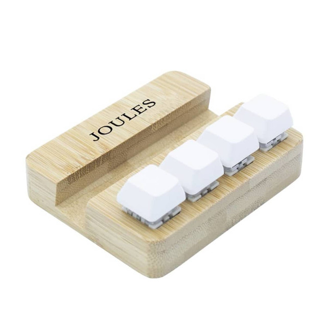 Bamboo stand holder featuring four white key pressing stress relievers. Includes a logo on the side. Bamboo stand holder featuring four white key pressing stress relievers. Includes a logo on the side.