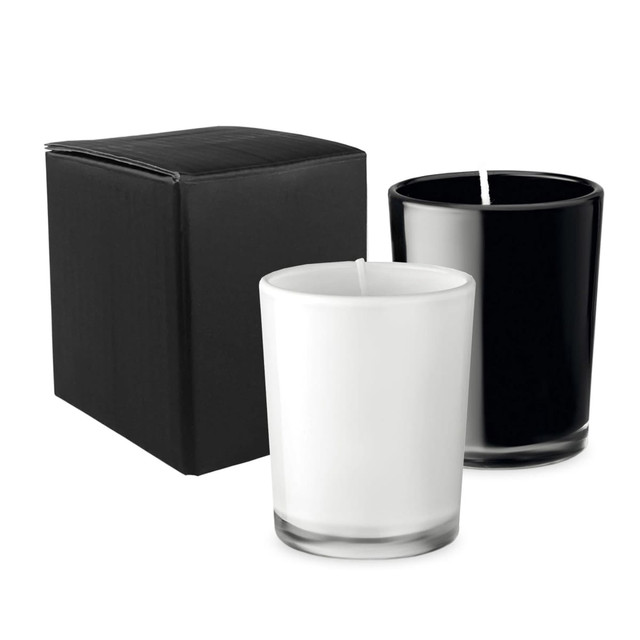 A set of two glass candles, one white and one black, packaged in a black box. A set of two glass candles, one white and one black, packaged in a black box.