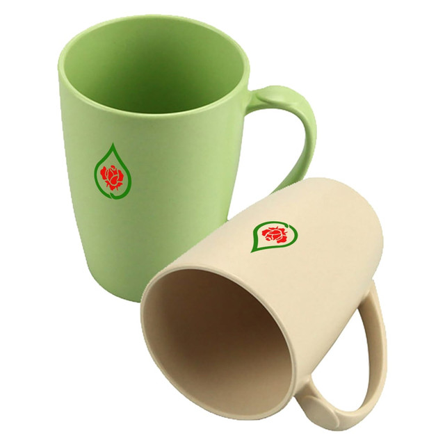 Two reusable bamboo mugs in green and beige, featuring a simple logo on the front of each. Two reusable bamboo mugs in green and beige, featuring a simple logo on the front of each.