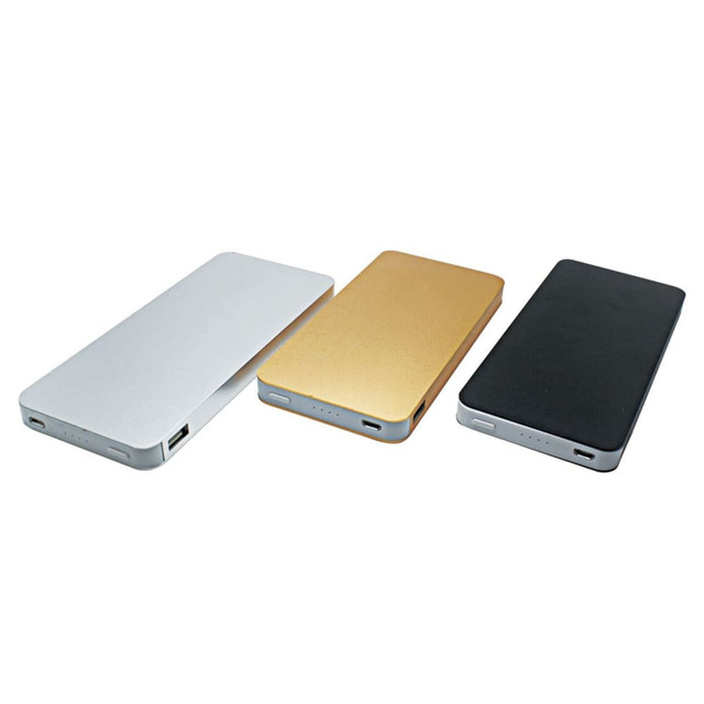 A power bank featuring three colours: silver, gold, and black, with USB ports and a logo. A power bank featuring three colours: silver, gold, and black, with USB ports and a logo.