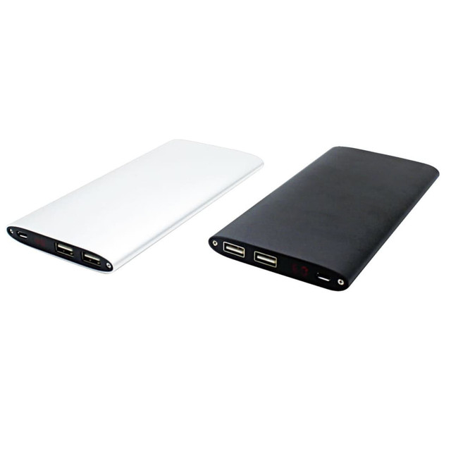 A power bank in white and black, featuring multiple USB ports and a logo.