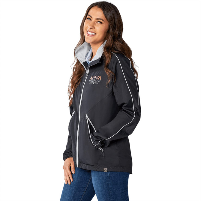 A woman wearing a black rain jacket with a light grey inner lining, featuring a logo and white accents.
