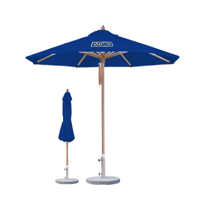 A blue octagon outdoor umbrella with a wooden pole and a logo, alongside a folded umbrella.
