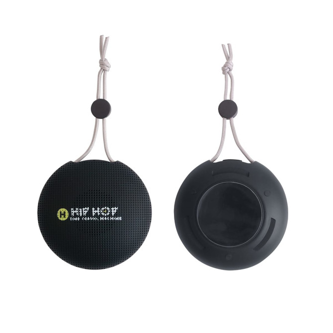A round, black portable waterproof Bluetooth speaker with a hanging strap and a logo displayed on the front.
