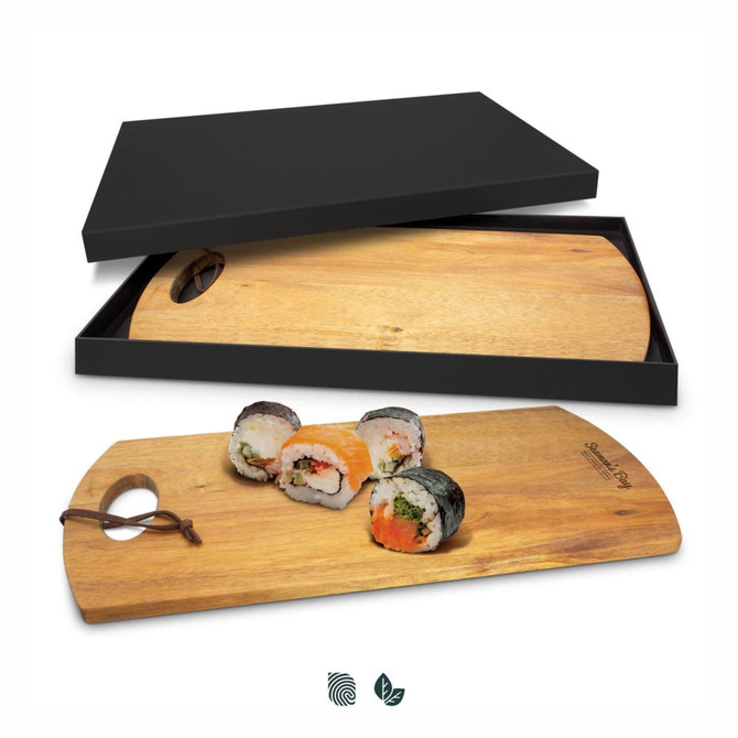 A wooden serving board with a natural finish, featuring sushi, presented in a black gift box.