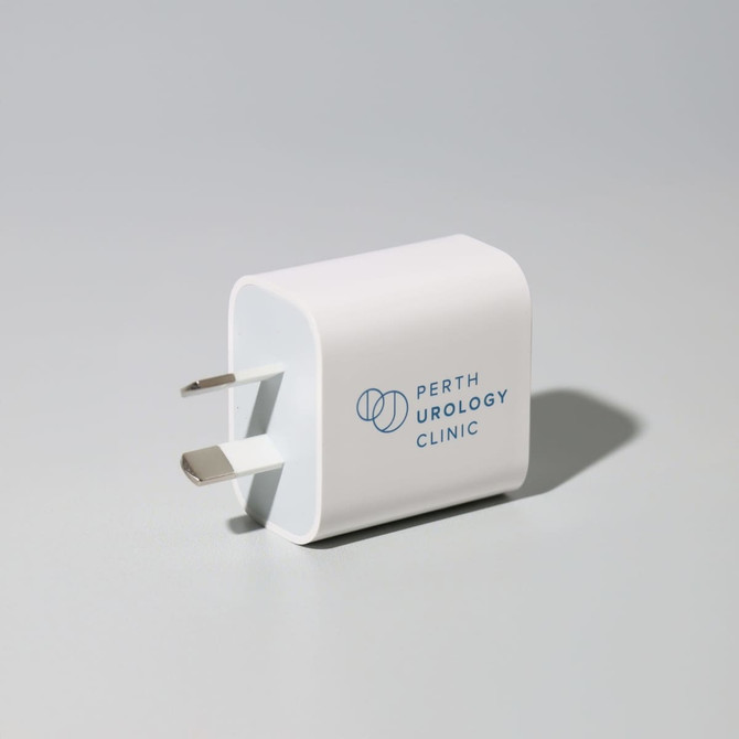 A white fast charge adapter with two prongs and a logo on the side, designed for phone and technology use.