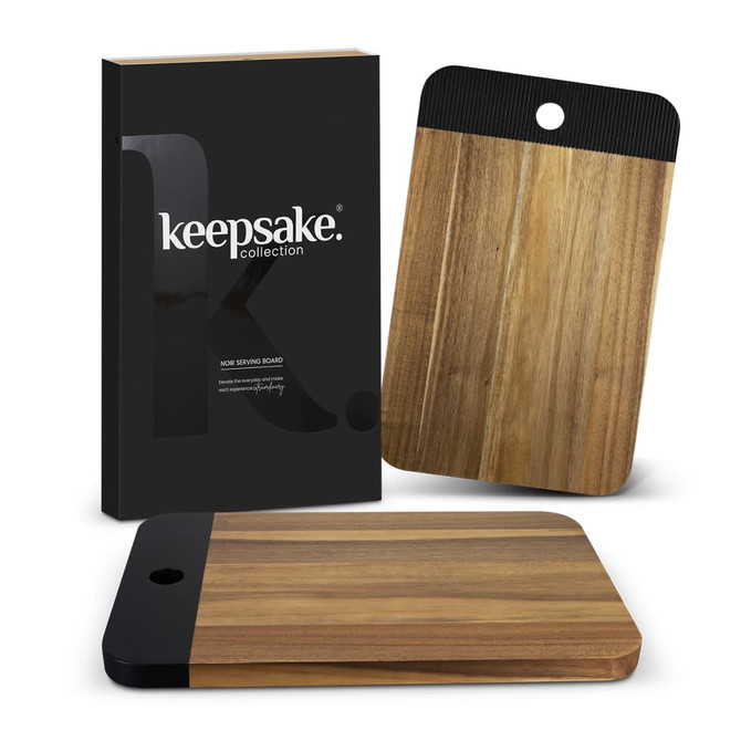 A wooden serving board with a black handle, presented with sleek packaging featuring a logo.