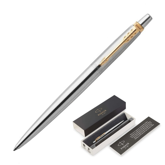 A metal ballpoint pen in brushed stainless steel with gold accents, displayed in a gift box.