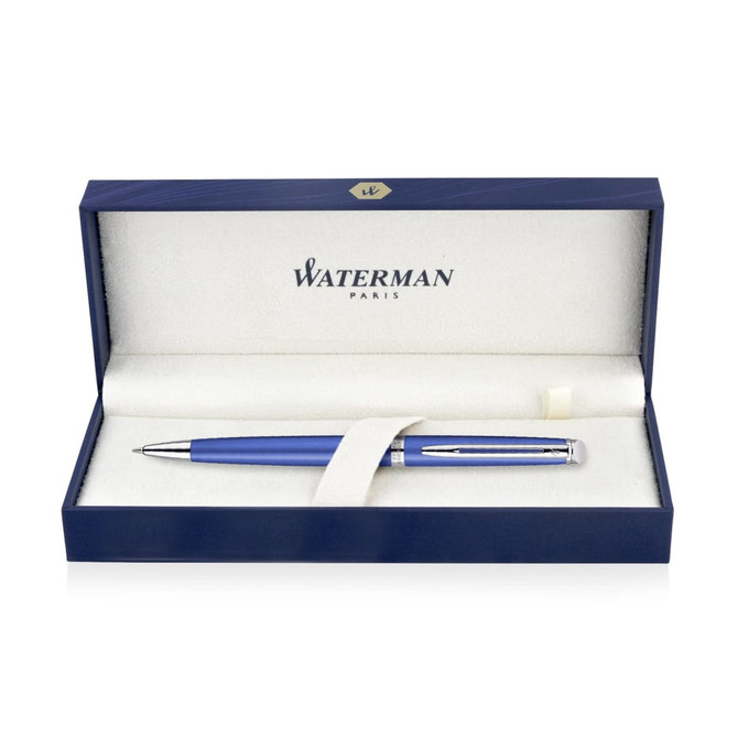 A bright blue ballpoint pen displayed in a navy box. The interior features a soft lining and a logo.