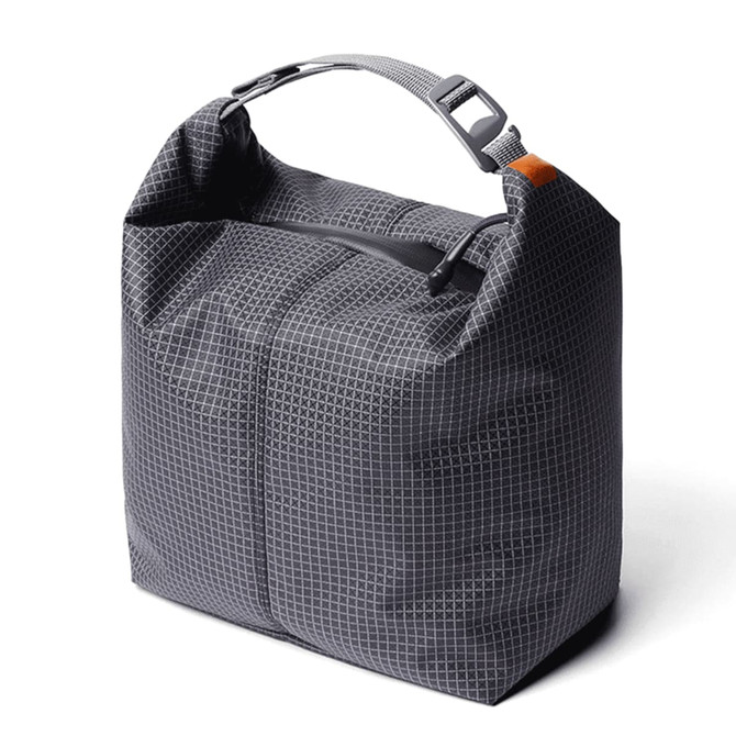 A grey cooler bag with a minimalist design, featuring a top handle and a zip closure, alongside a branding logo.