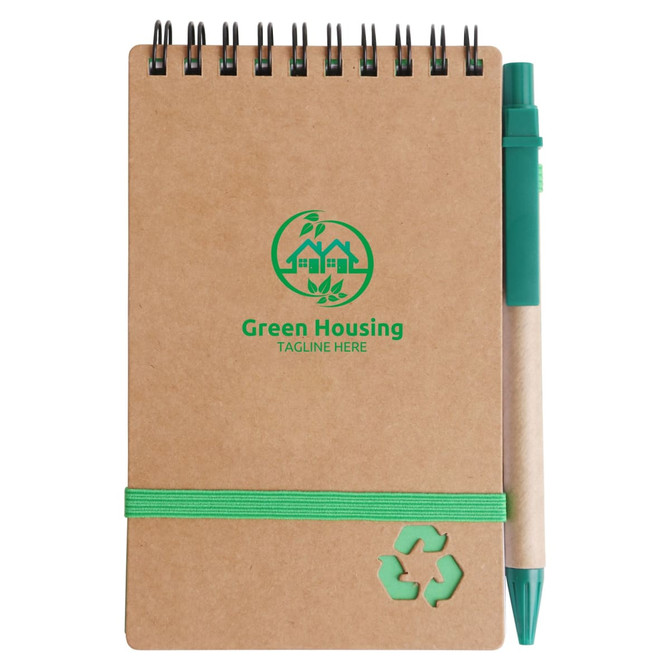 A brown spiral notebook with a green pen attached, featuring a logo and a green elastic band.