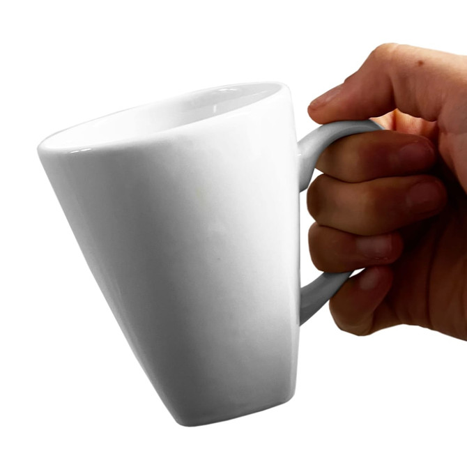 A white coffee mug with a tapered design, held by a hand, featuring a logo.