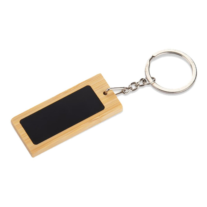 A rectangular bamboo keyring with a black chalkboard-style surface and a silver keyring attachment.