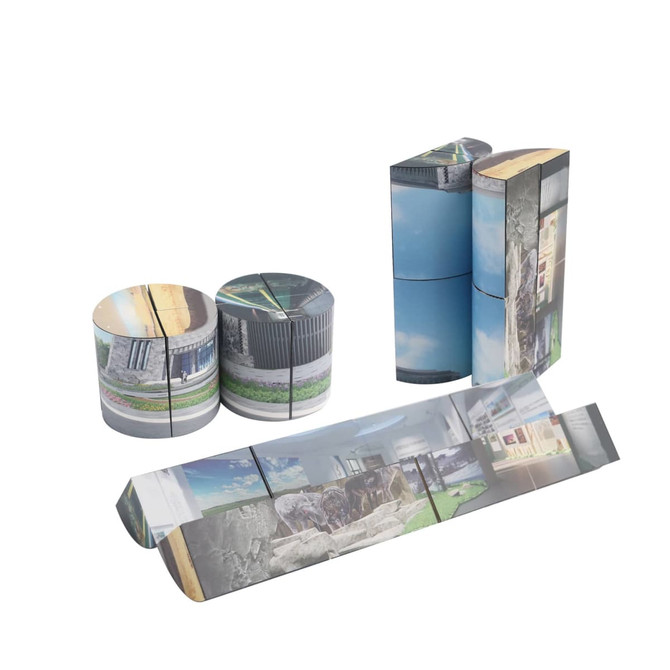 A 3D Flips Cylinder Magic Cube featuring a mix of grey and blue with photographic designs on its faces. It includes multiple connecting pieces and a logo.