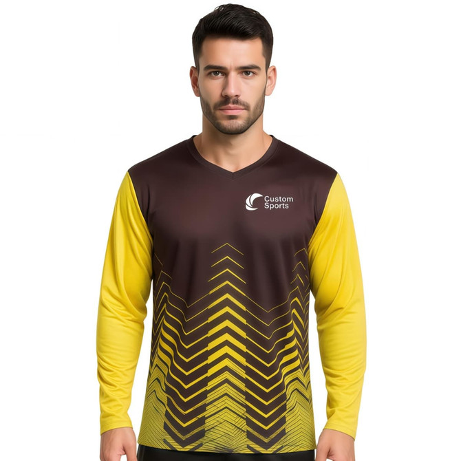 A unisex long-sleeve shirt in brown and yellow, featuring a sublimated zigzag design and a logo.