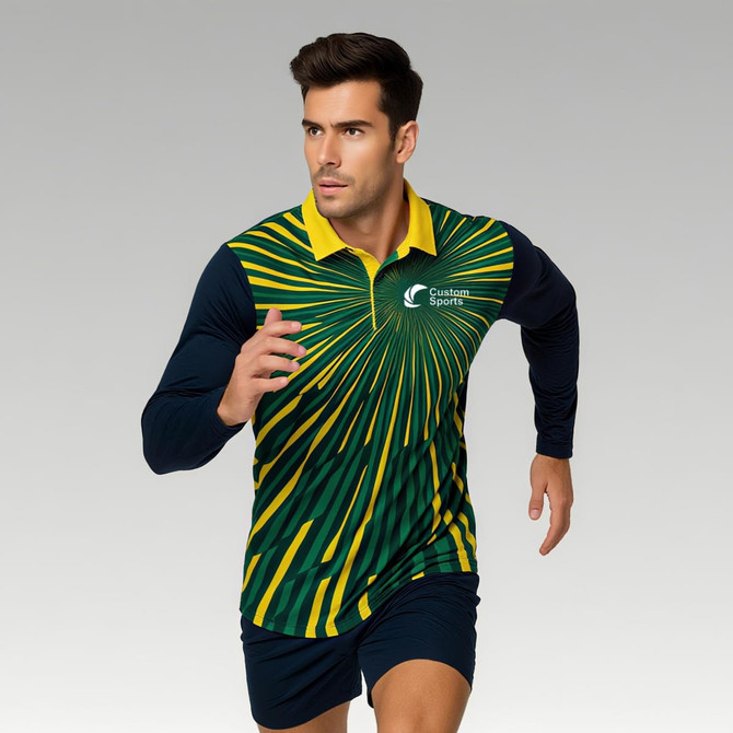 A man is wearing a long-sleeve polo in green and yellow with a striking sunburst design, featuring a logo.