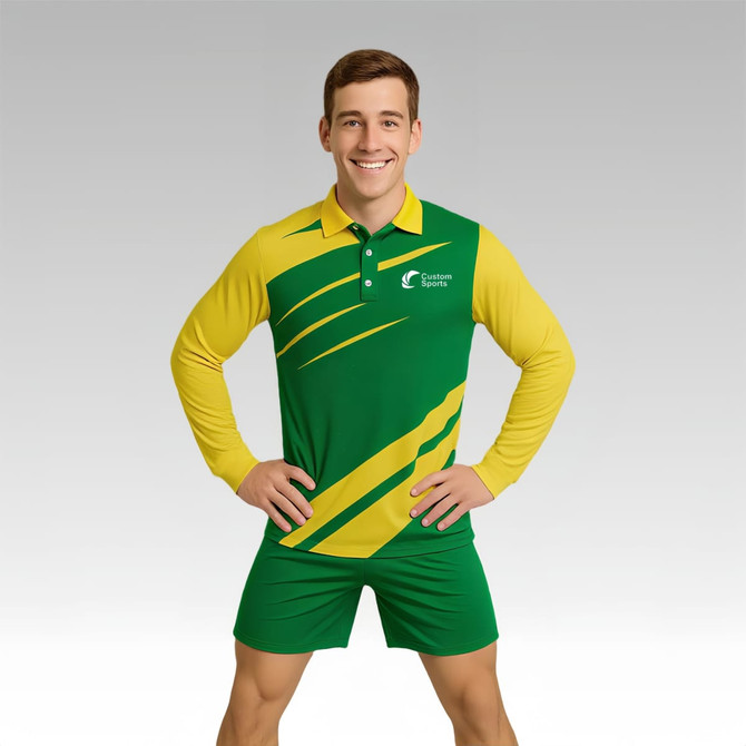 A model wears a green and yellow long-sleeved polo shirt with a logo on the chest, paired with matching shorts.