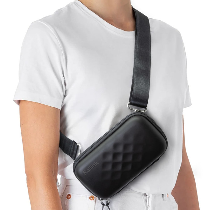 A black Rollink Mini Bag Tour worn across a person's body with a strap, featuring a textured surface.
