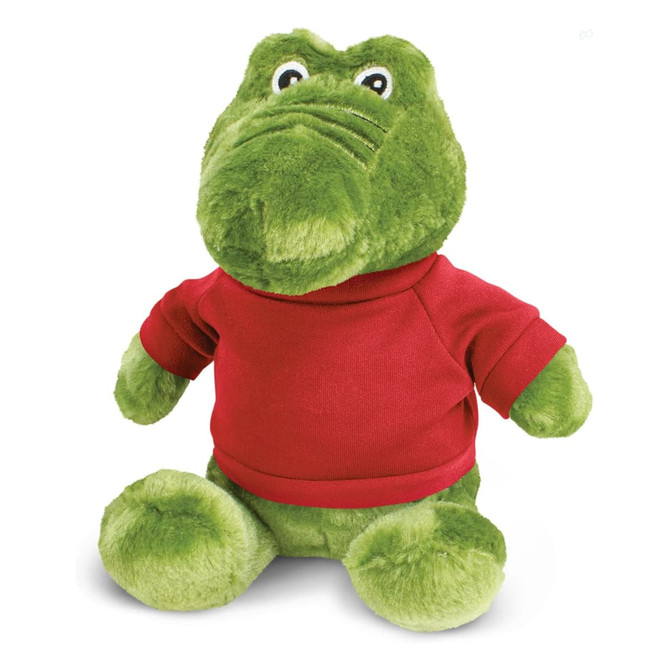 A green crocodile plush toy wearing a red shirt, featuring large eyes and a friendly expression.
