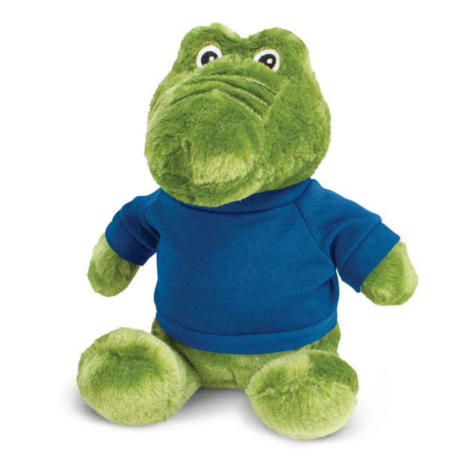 A green crocodile plush toy wearing a blue shirt, featuring a friendly face and soft, textured fabric.