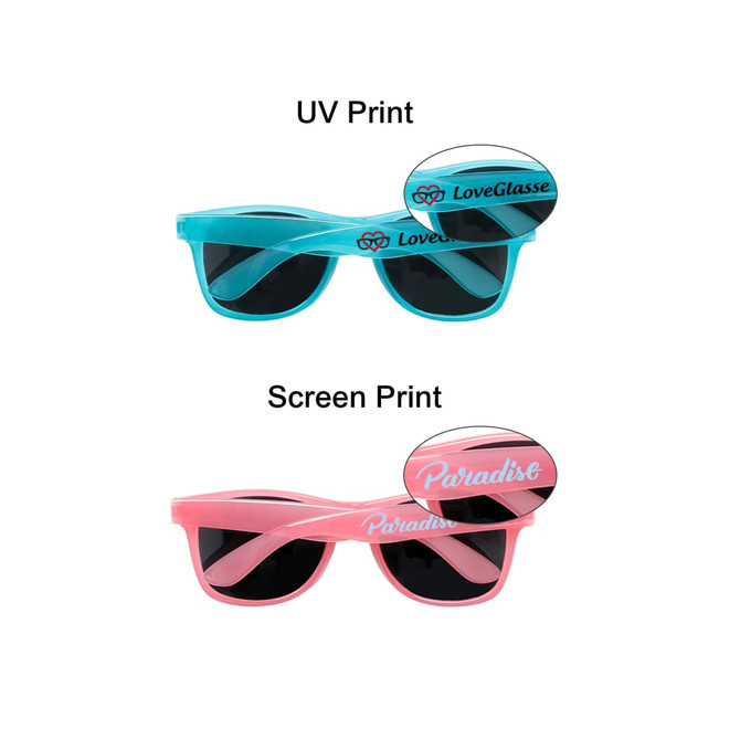 Glow in the dark sunglasses in blue and pink, featuring a logo on each pair and dark lenses.