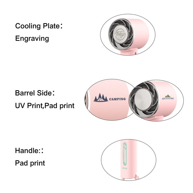 A personal cooling fan in pink with a handle, featuring engraved and printed designs on the barrel side.
