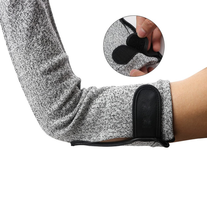 A pair of grey cut resistant sleeves is shown, featuring a black fastening and textured fabric.