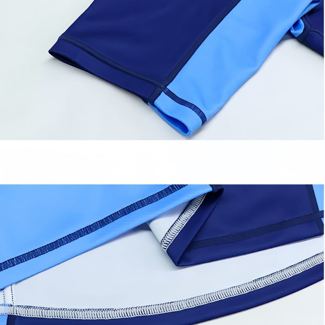 A crew neck raglan tee shirt in navy and light blue polyester micro mesh, featuring flatlock seams and a logo.
