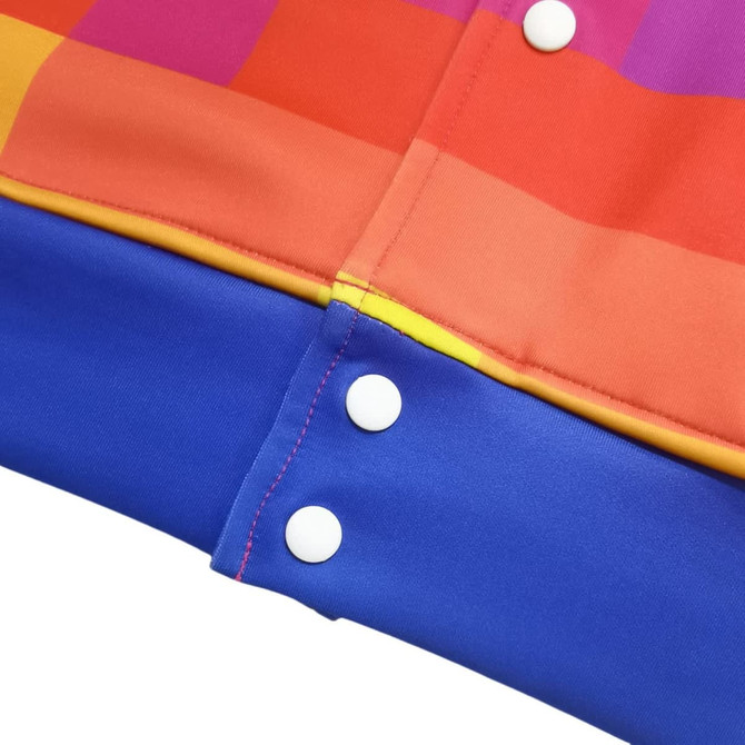 A vibrant unisex polyester spandex track jacket featuring orange and blue panels with snap buttons.