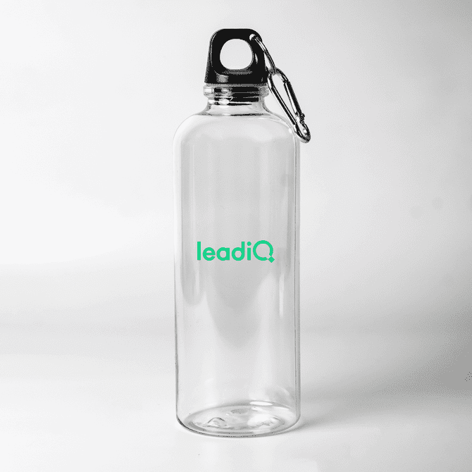 A drink bottle made of clear plastic with a black lid and a carabiner, featuring a logo.