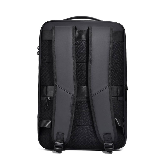 A black expandable hardshell backpack with padded shoulder straps and a structured back panel. Features a logo.