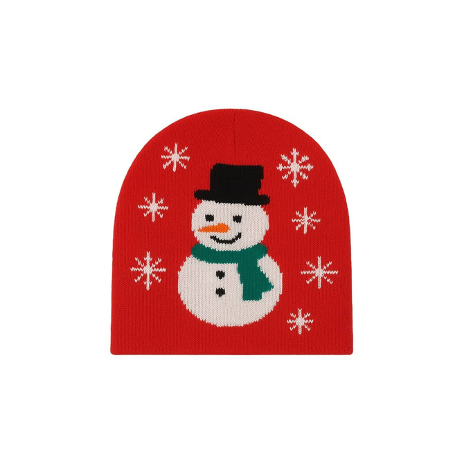 A red beanie featuring a snowman design with a black hat, green scarf, and white snowflake patterns.