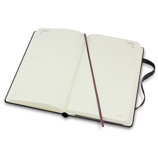 A black Moleskine 2026 Daily Planner, open, featuring lined pages and a ribbon bookmark.