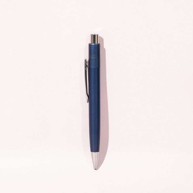 A blue ballpoint pen with a silver tip and clip, featuring a logo on its body.