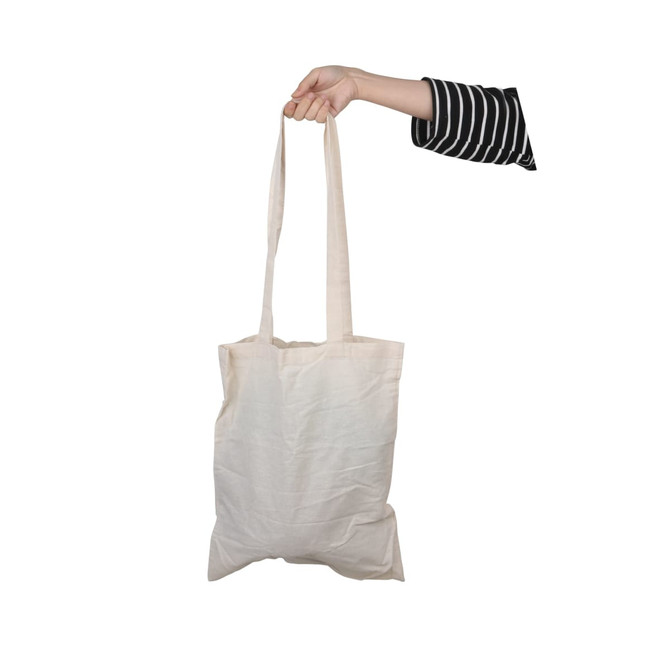 A long-handled calico bag in off-white being held by a hand, featuring a simple design and subtle branding.