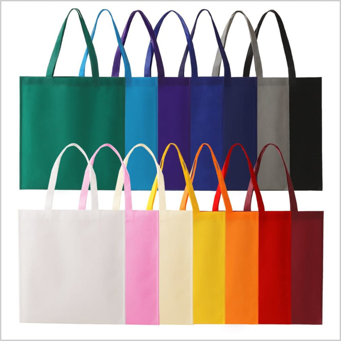 A set of tote bags in various colours including green, purple, blue, grey, pink, yellow, orange, and red. Each bag has handles and a simple design.