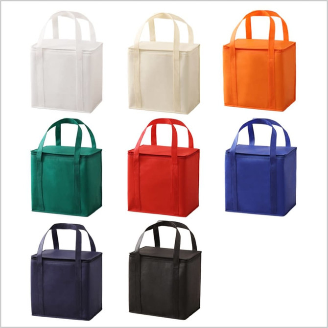 A selection of nine small tote bags in white, cream, orange, green, red, blue, and black with handles.