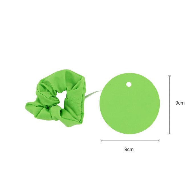 A green drink cover scrunchie and a circular tag, both measuring 9cm. The scrunchie has a gathered fabric design.