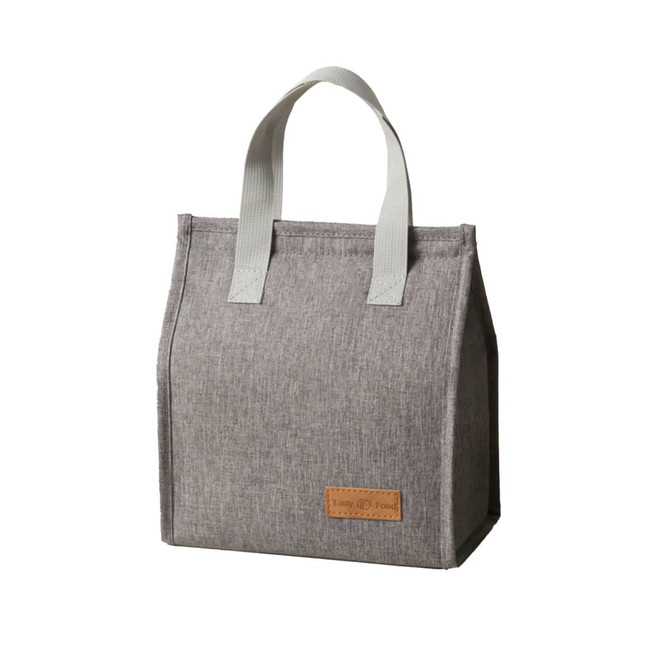 A grey minimalist lunch bag with a rectangular shape and two handles, featuring a small logo.