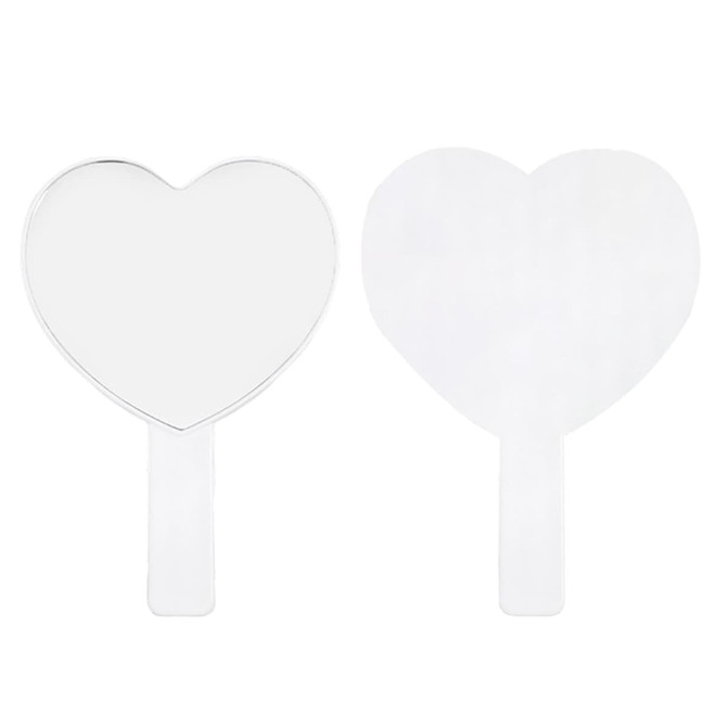 A heart-shaped handheld mirror with a transparent handle, featuring a smooth, reflective surface.
