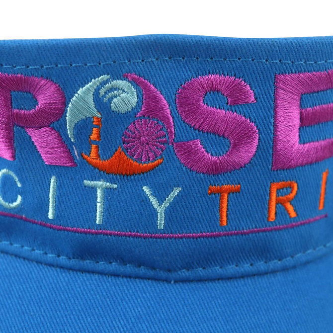 A blue sport visor featuring embroidered text and a logo. It has a wide brim for sun protection.